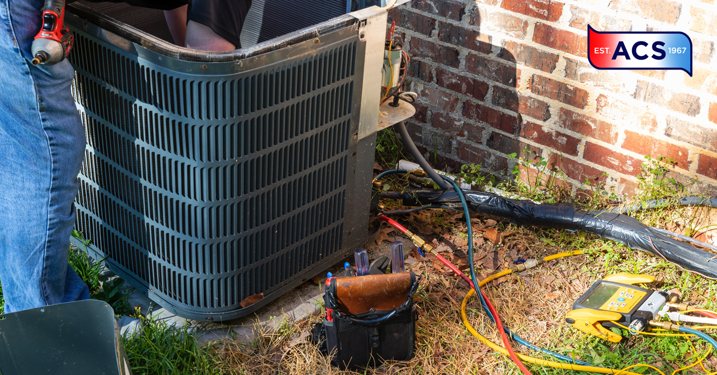 HVAC person fixing outdoor unit to avoid making the HVAC warranty void